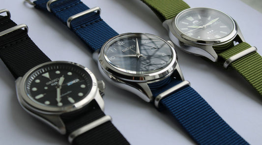 Seikos and Orient with 3 NATO watch straps