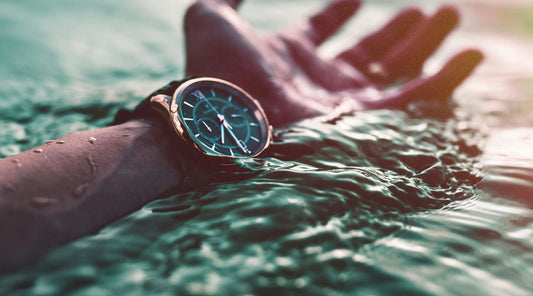 man in water wearing watch