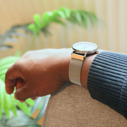 Man Wearing Milanese Mesh Magnetic Strap Resting Hand On Sofa Arm